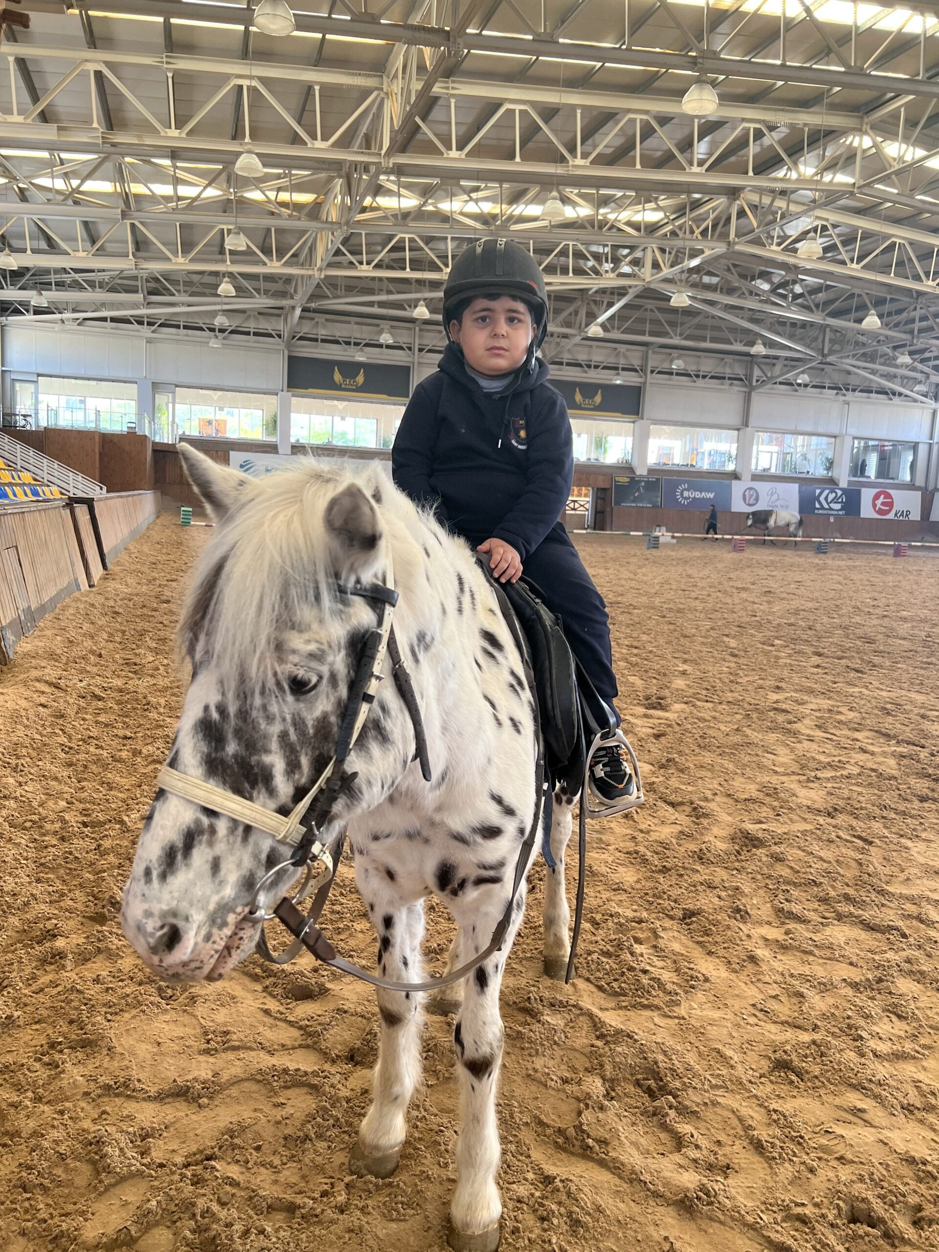 a child riding a horse in a arena, Sanny Private Kindergarten Erbil