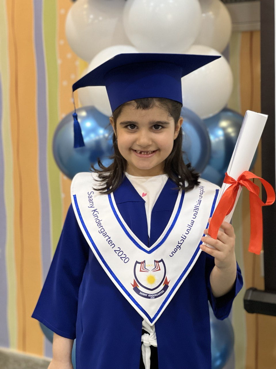 young girl, graduation gown