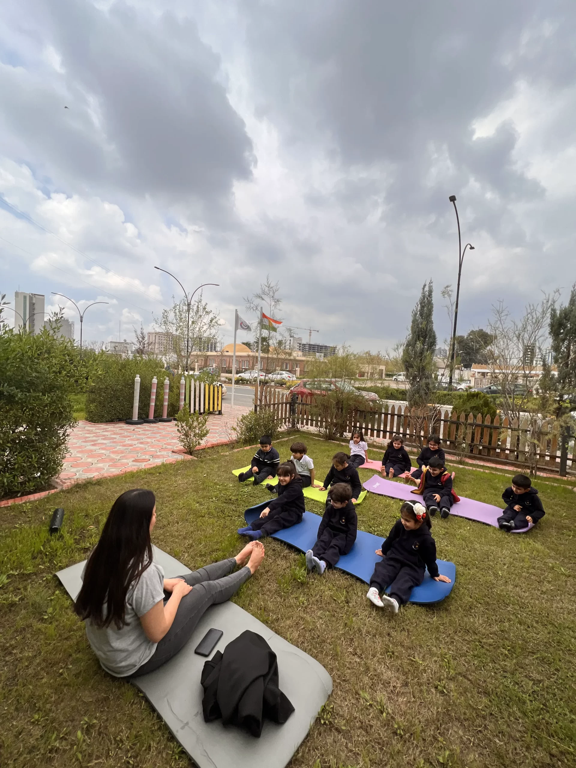 group, yoga mats, park, sanny kindergarten students in yoga class.