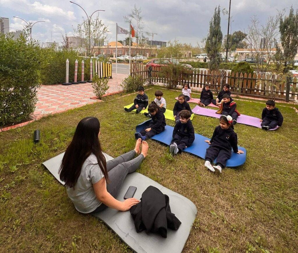 group, yoga mats, park, sanny kindergarten students in yoga class.