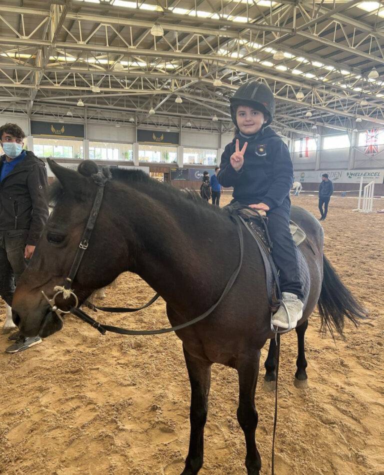 a child riding a horse in a arena, Sanny Private Kindergarten Erbil